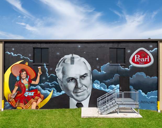 a mural depicting local business owner, Mr. JC Giglio