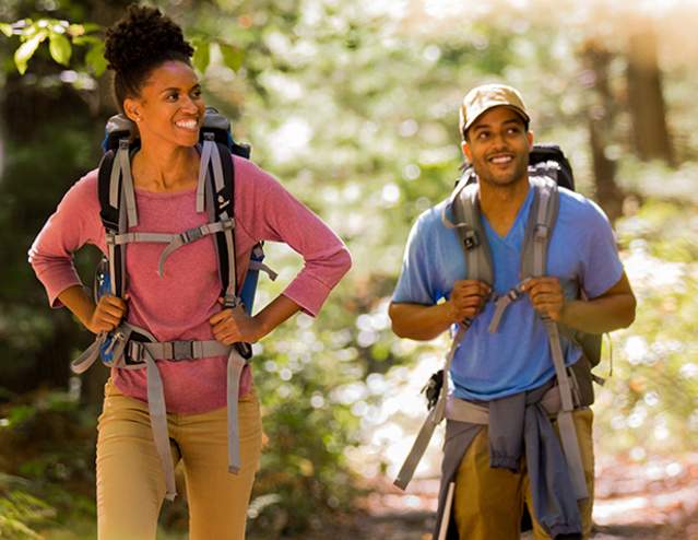 Couple with backpacks hiking the Appalachian Trail
