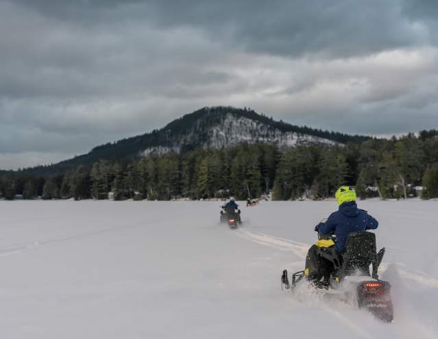 A group of snowmobiles on Loon Lake