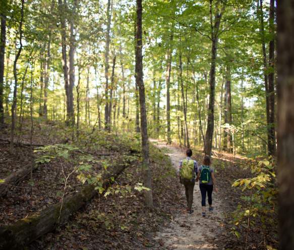 Two people hiking at Monroe Lake