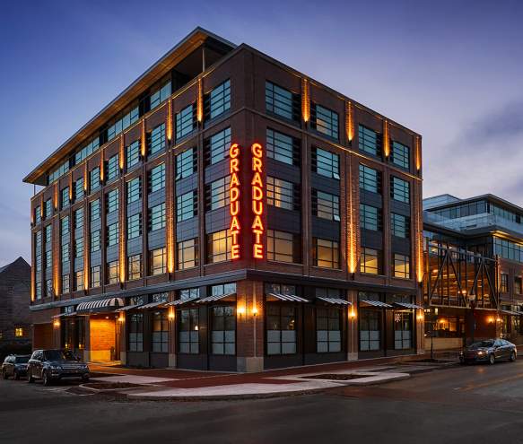 Outside of the Graduate Hotel at dusk