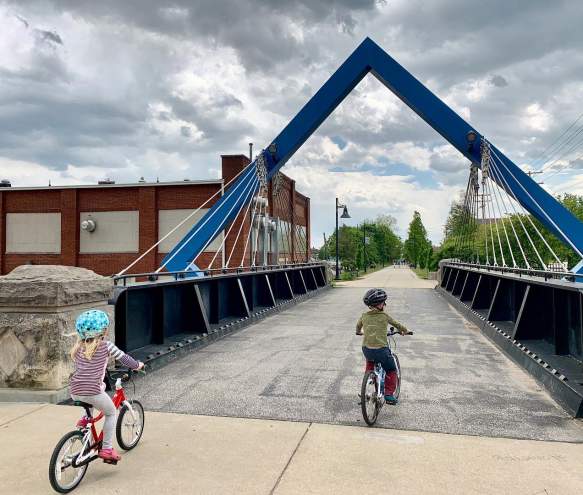Two kids riding bikes on the B-Line Trail