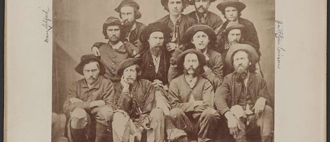 Photograph shows group portrait of former prisoners of war and guides taken upon their arrival at Knoxville, Tennessee, on January 1, 1865.