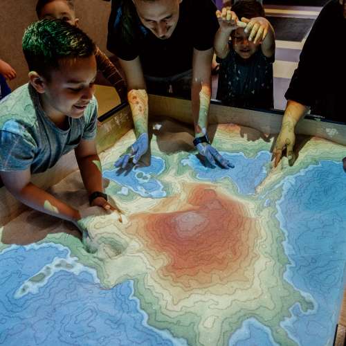 Boy doing a science experiment at Science Central