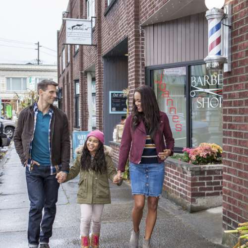 Mother, Father and Daughter Windows shopping in Sumner, Washington