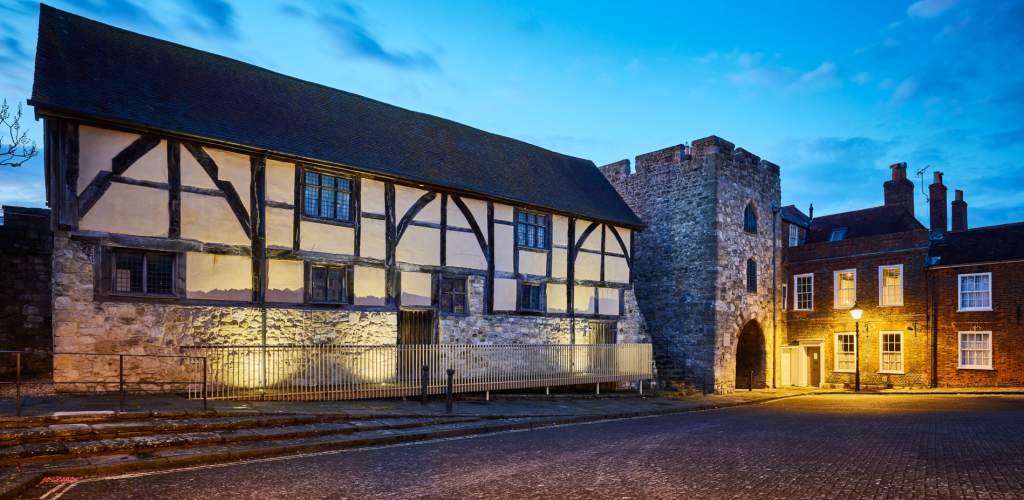 The historic Westgate Hall in Old Town lit up at dusk