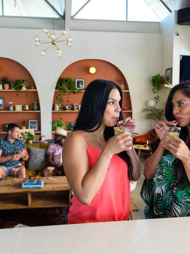 Friends Sipping Cocktails at Boozehounds Palm Springs