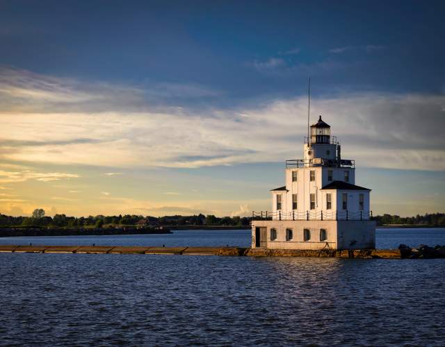 Manitowoc Breakwater Lighthouse at sunset by Bill Chizek