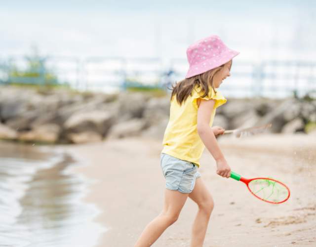 Girl Playing at Lighthouse Park Beach in Manitowoc