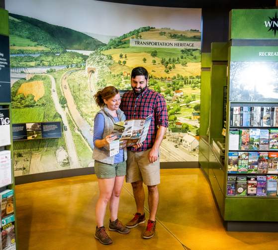 Hikers looking at a map in the Frederick Visitor Center