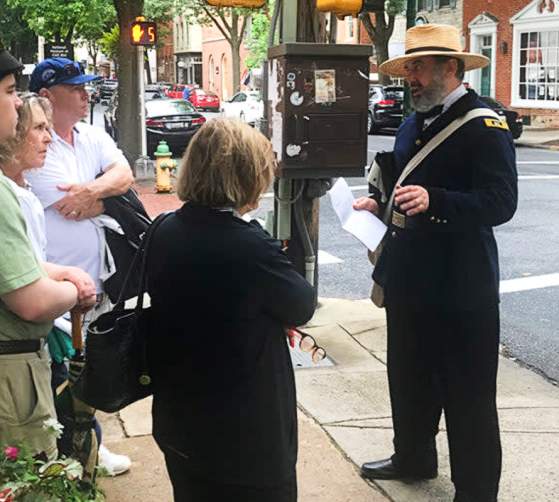 Walking Guide with group on One Vast Hospital Walking Tour