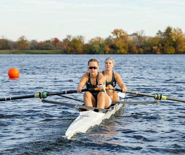 Two female EMU rowers on Ford Lake