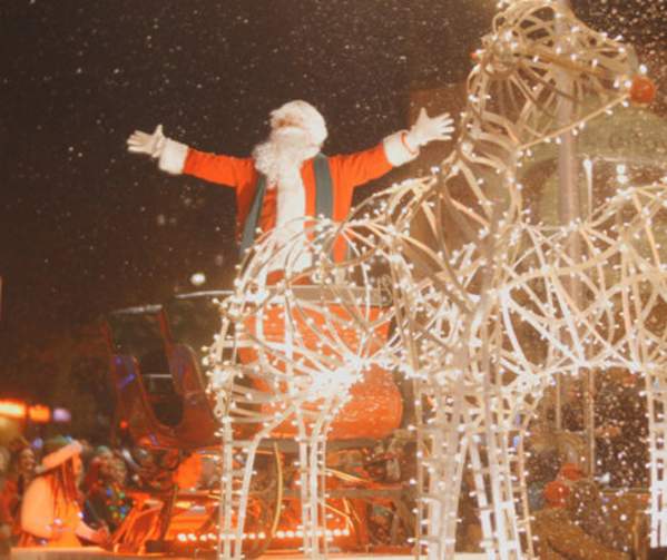 Father Christmas on a lit up sleigh at the Swansea Christmas Parade