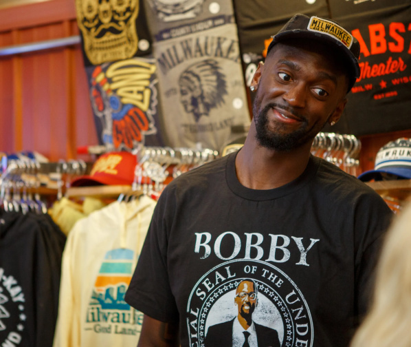 Bobby Portis in front of a wall of milwaukee merch