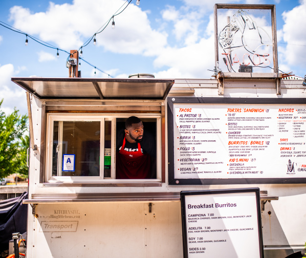 Bobby Portis sticking his head out of a taco food truck service window