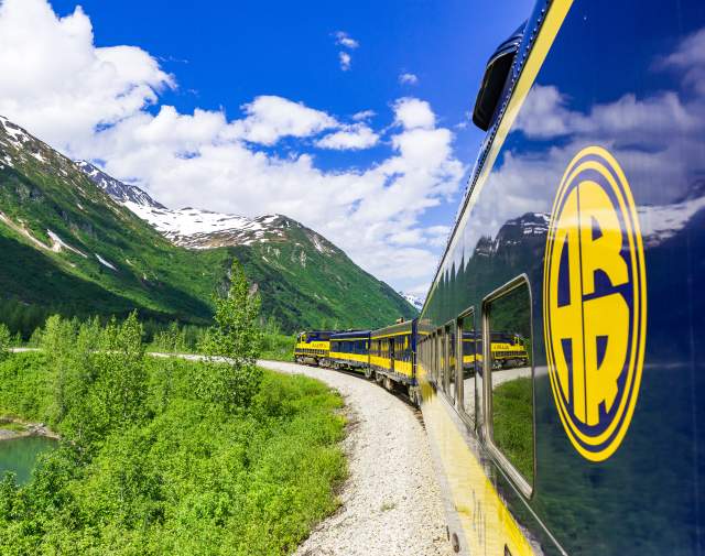 The Alaska Railroad's Glacier Discovery Train steams through the Chugach Mountains and the Grandview area.