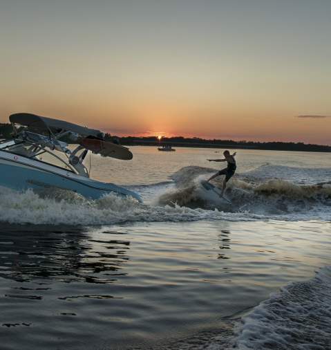 Man Wakeboarding Behind a Boat in Panama City Beach