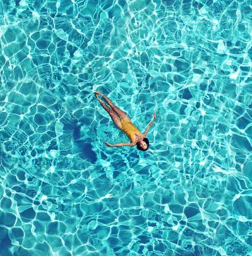 Woman floating in a pool