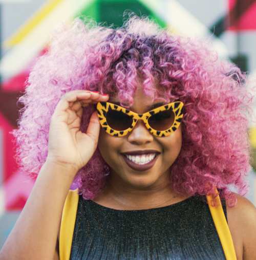 Woman with purple hair & sunglasses