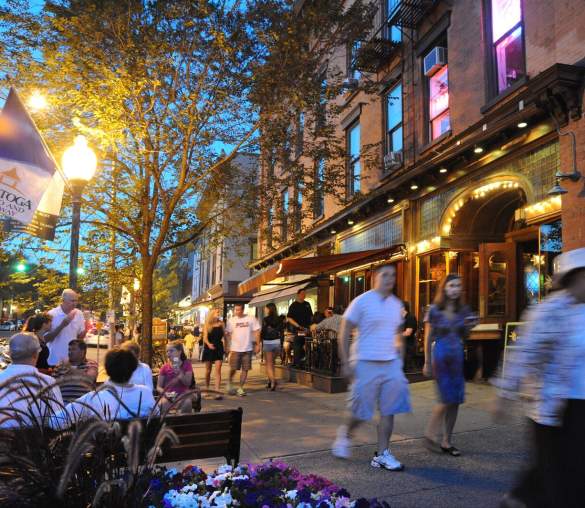 People roaming the streets of downtown saratoga