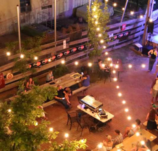 Illuminated outdoor patio and stage