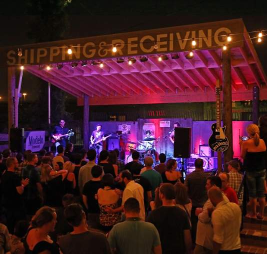 Group of people listening to a band play
