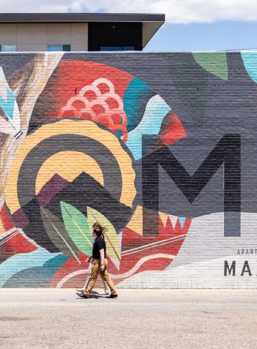 Mural on the side of the building of the apartments at Maddie