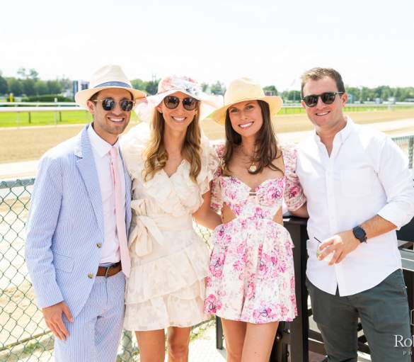 two couples dressed in race course attire