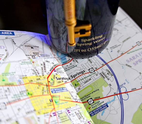Map of Saratoga Springs with bottle of Saratoga Water