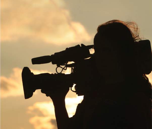 silhouette of a cameraman