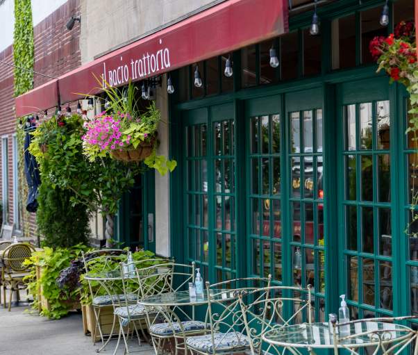 Cafe-style seating lines the sidewalk outside of Il Bacio Trattoria in Bronxville.
