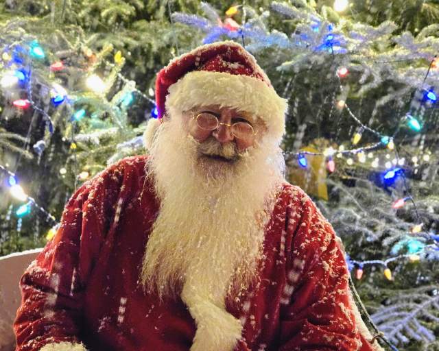 Santa in the snow at the Grand Lake Tree Lighting Ceremony