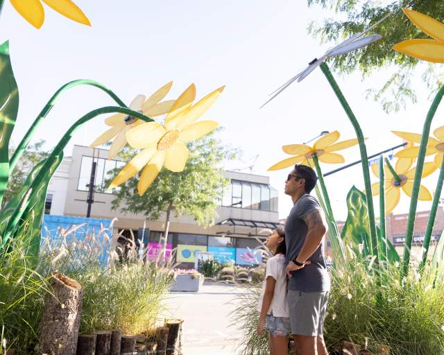 Dad and Daughter looking at Art on Meet me on Bernard