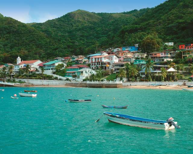 Beautiful view of Taboga Island town and beach in a sunny day