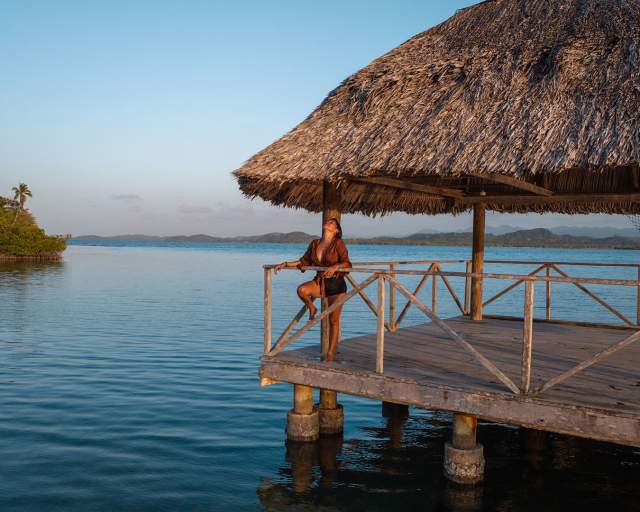 Woman relaxing at the beach of Playa Paraiso in Portobelo