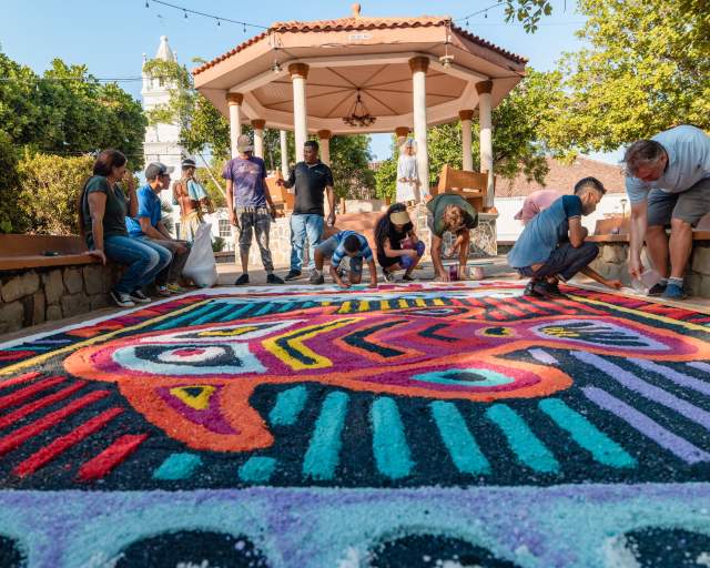 Group working on Corps Christi carpet