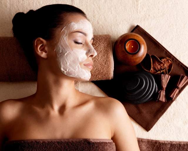 A women relaxing with facial spa treatment
