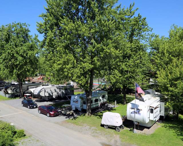 A row of RVs at a campground