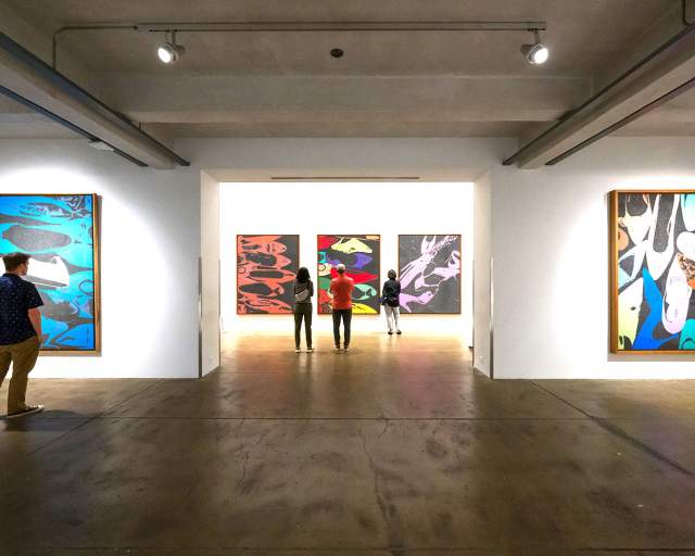 visitor viewing art work inside museum