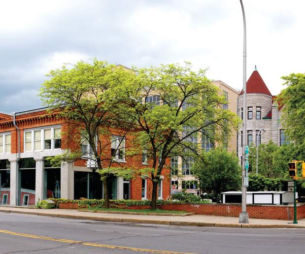 Panorama of Blue Skies and Green Trees Featuring Weighlock Building