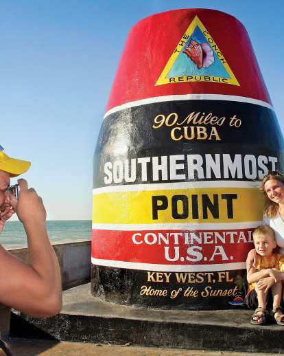 family at Southern Most Point marker