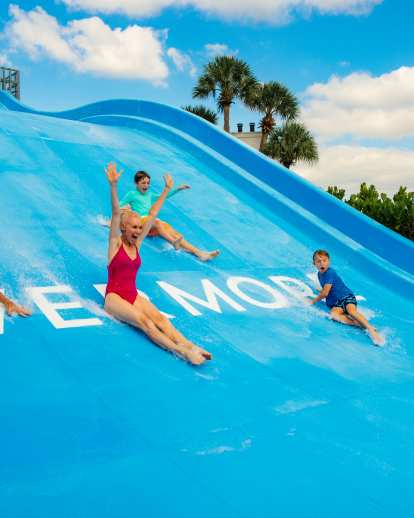 Orlando - Evermore Orlando Resort - Family Sliding into Pool