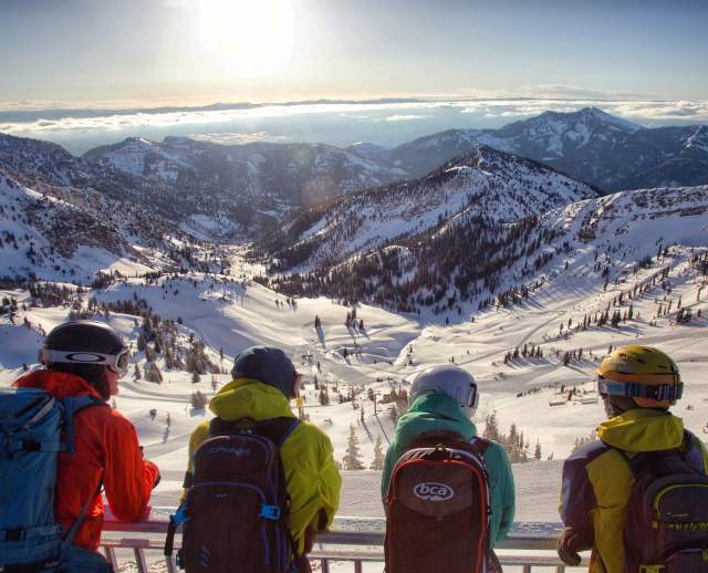Skiers overlooking the snow-covered mountains at Snowbird