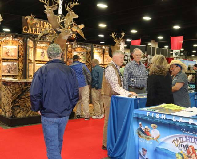 People visiting exhibitions at a show in the Mountain America Expo Center