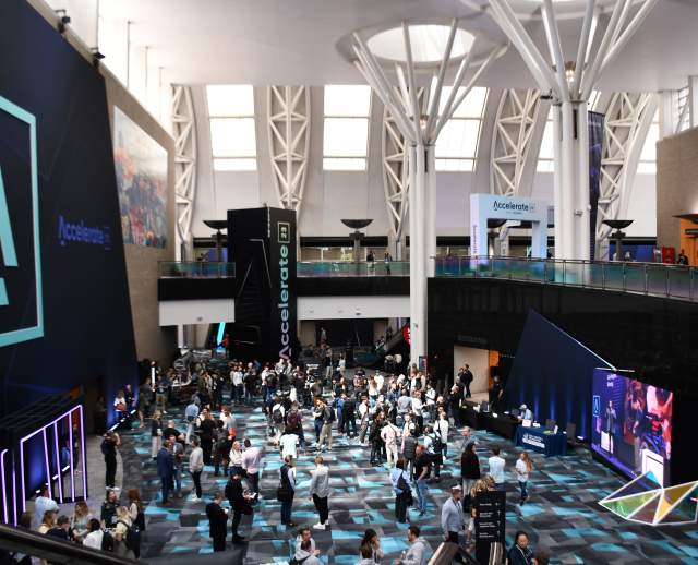 Photo of a large open area at the Salt Palace Convention Center from the top of the grand staircase looking toward the exhibit halls