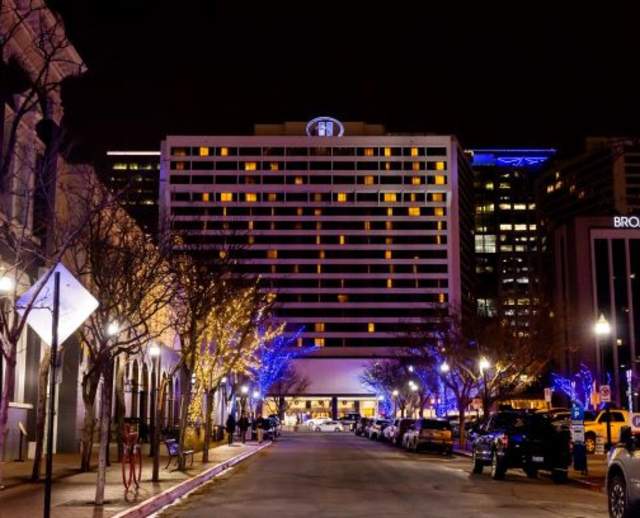 Nightime view looking down Broadway street toward the Hilton Salt Lake City Center