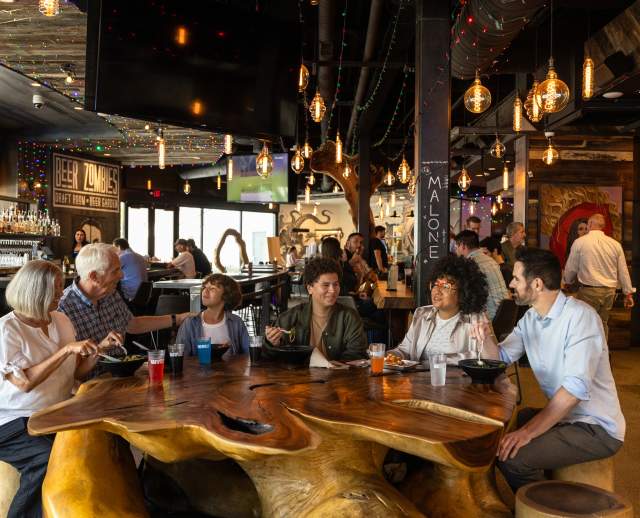 Image of a family eating at Hallpass in SLC