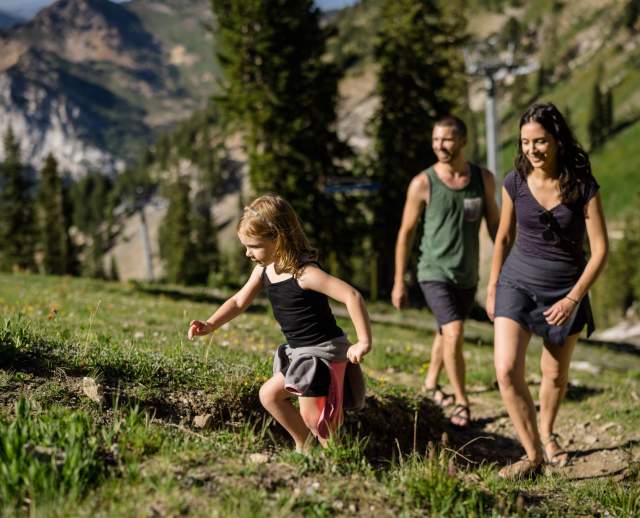Image of a family of three hiking in the Wasatch Mountains.