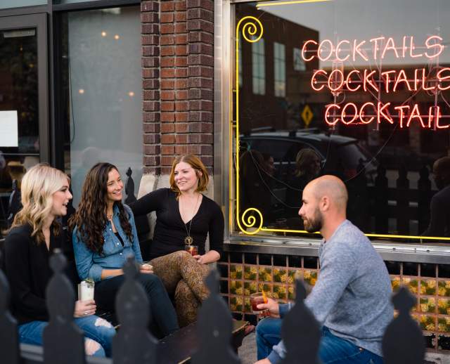 Friends drinking outside Bar X in downtown Salt Lake