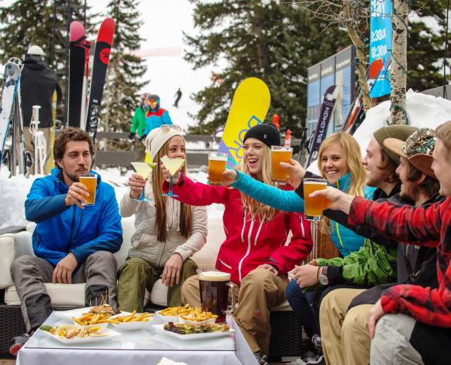 Friends Drinking at Snowbird Tram Deck after Skiing